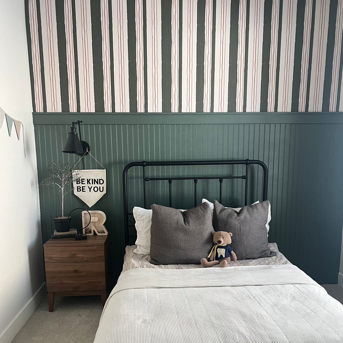 Lodge pattern wallpaper by Cassandra Zaniboni applied to a wall in a modern living space