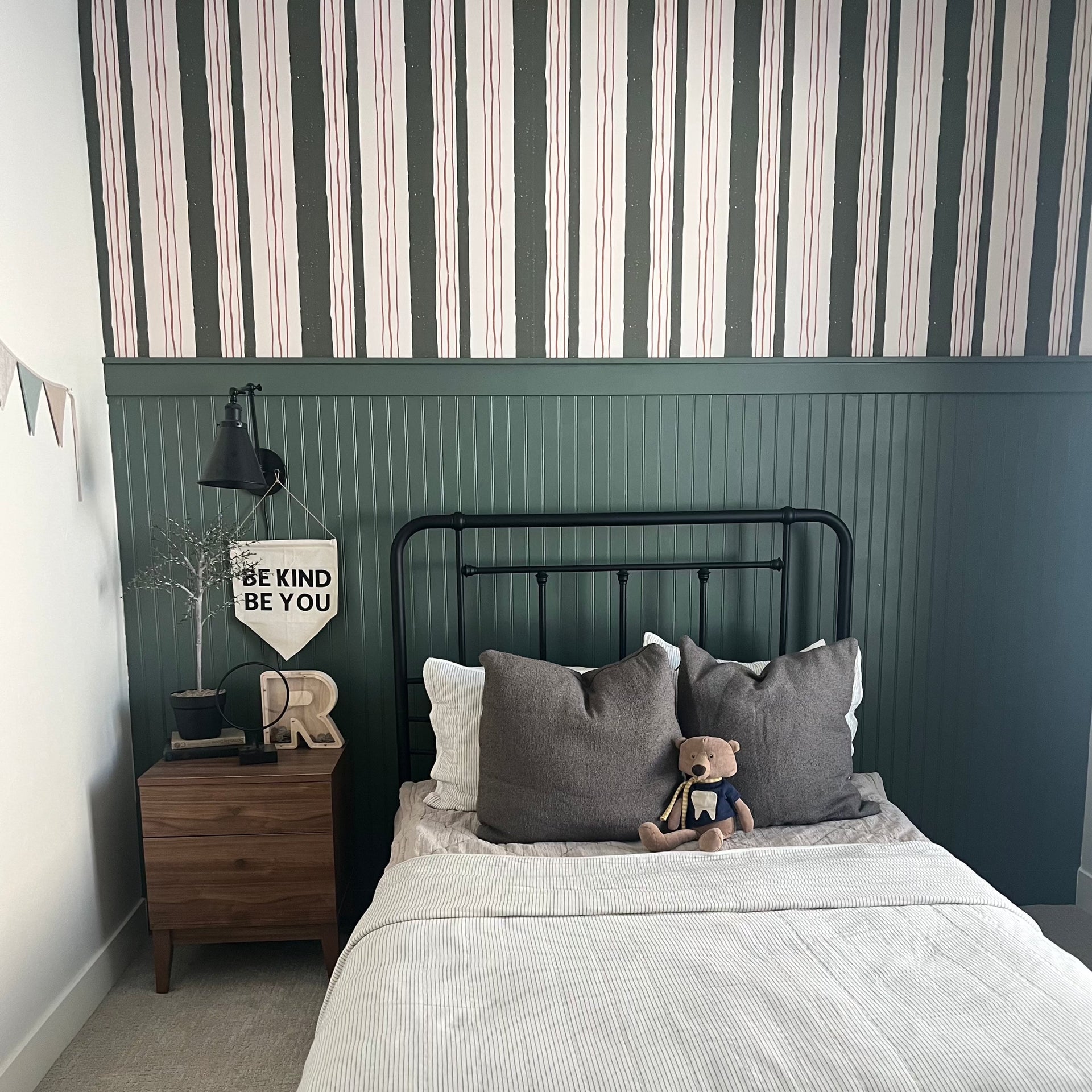 Lodge pattern wallpaper by Cassandra Zaniboni applied to a wall in a modern living space