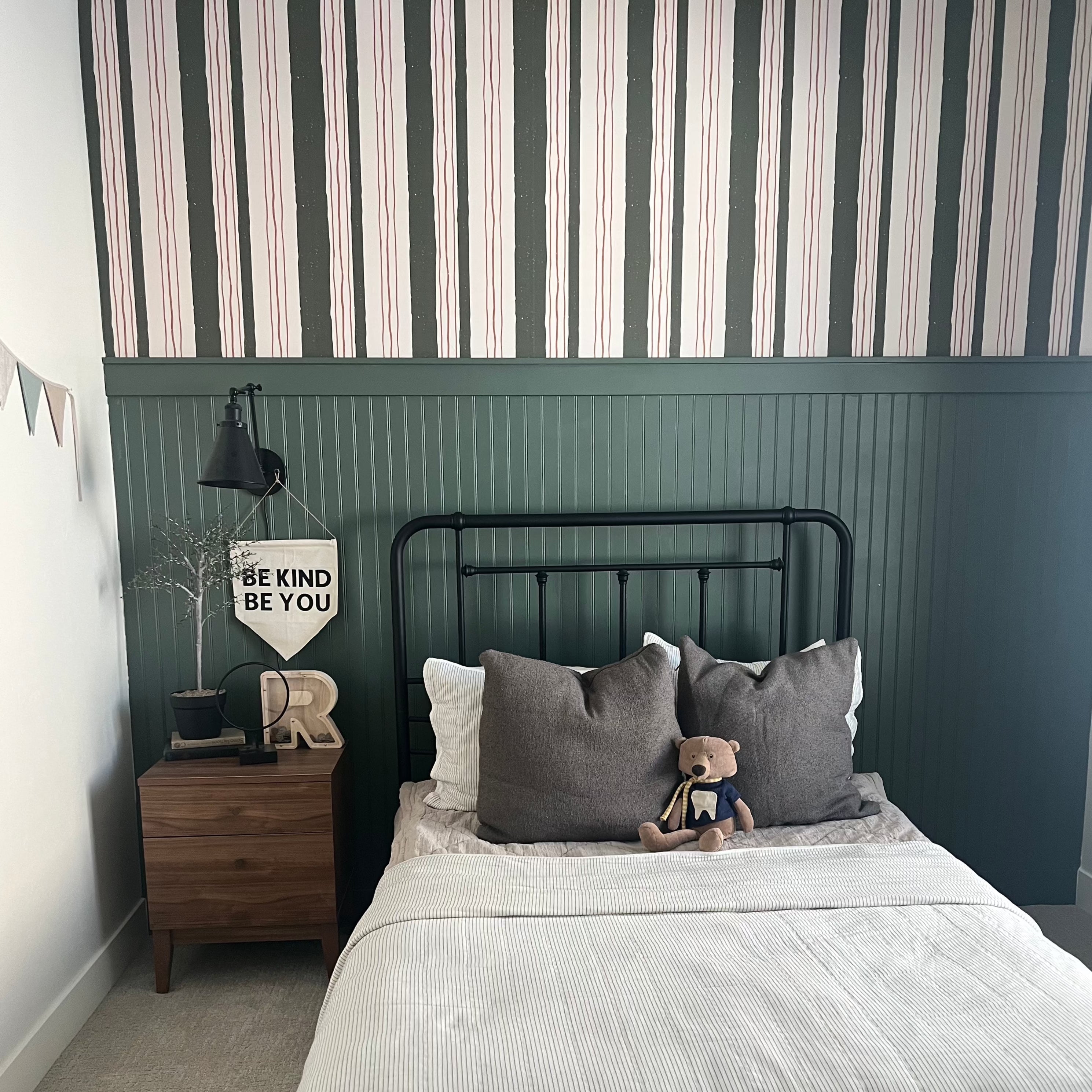 Lodge pattern wallpaper by Cassandra Zaniboni applied to a wall in a modern living space
