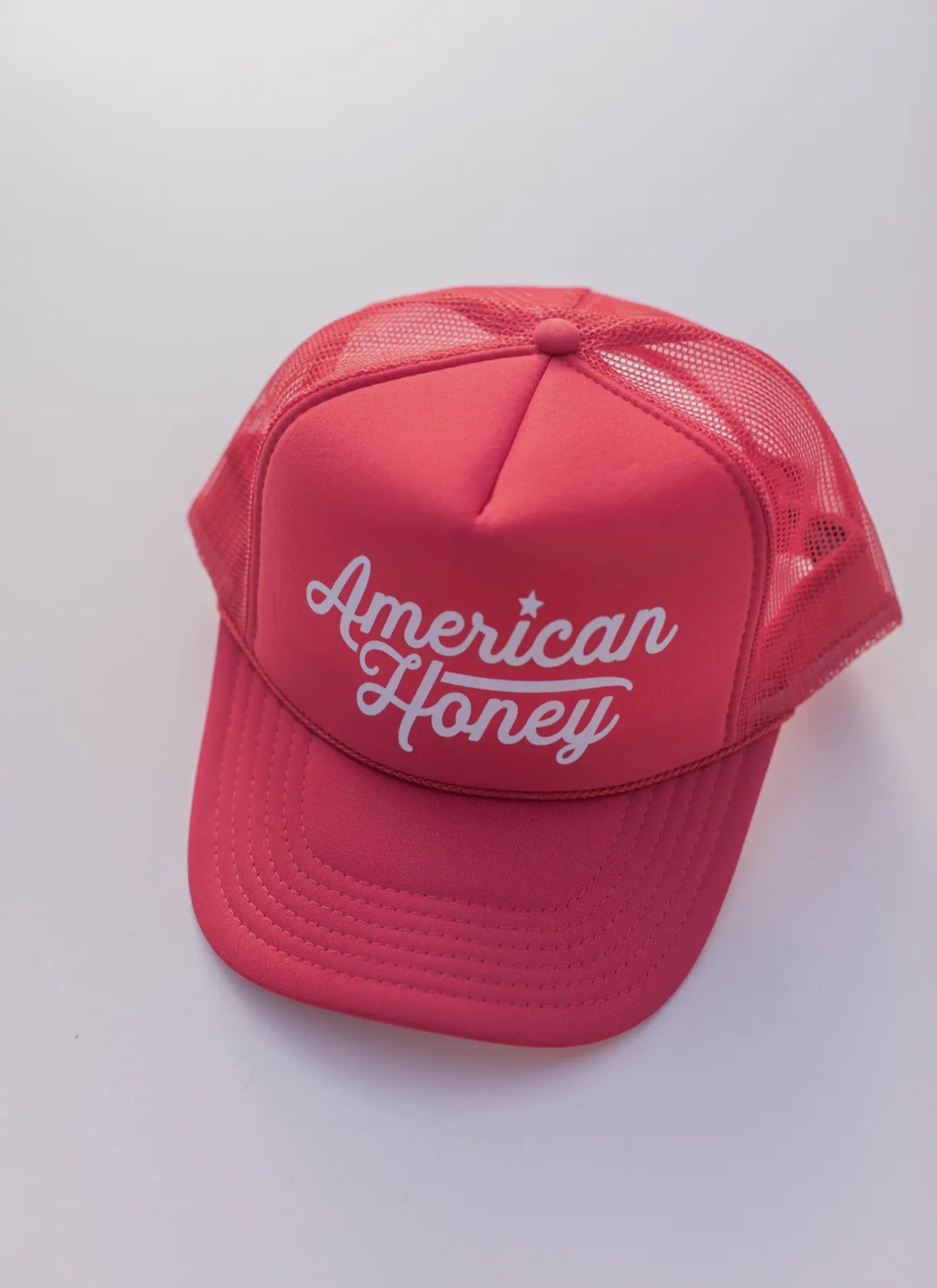 American Honey 5-panel foam trucker hat in pink and white with adjustable snapback