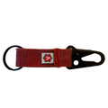 The Chauffeur Firehose Edition keychain clip in red, showing the textured fire hose material.