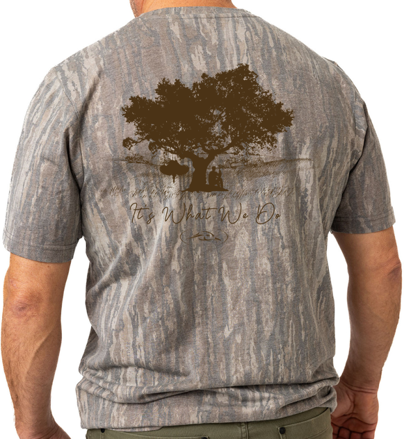 Back view of a person wearing a Realtree faded legacy camo t-shirt with a turkey hunting graphic
