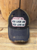 Distressed charcoal grey cap with tan mesh back and a patch that reads Excuse me, You Look Like You Love Me