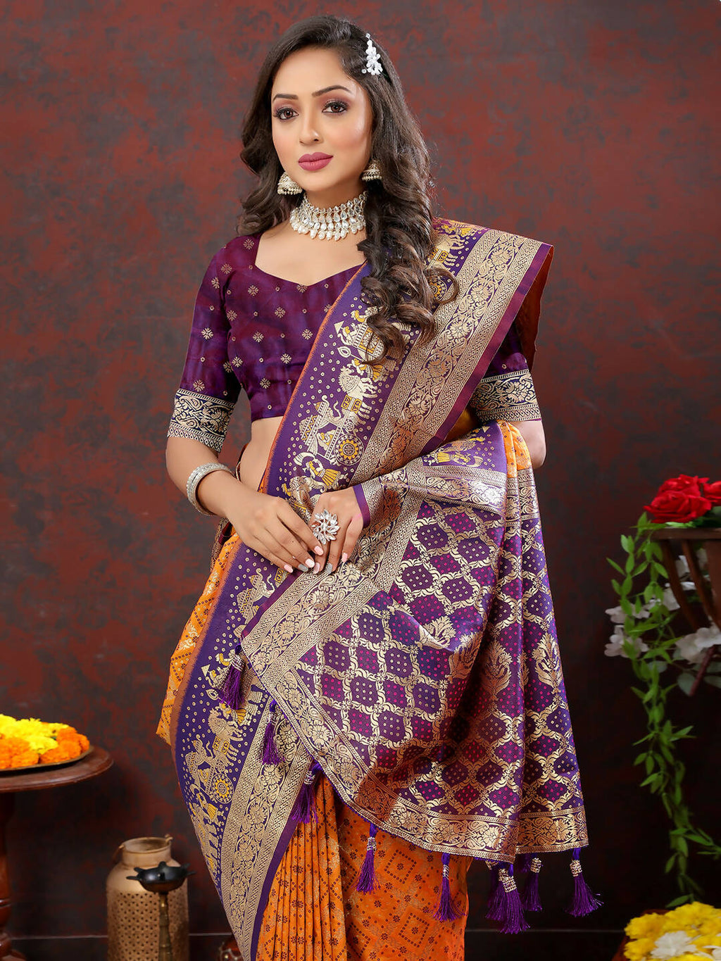 Beautiful Orange and Wine Patola silk saree featuring traditional Meenakari weaving design.