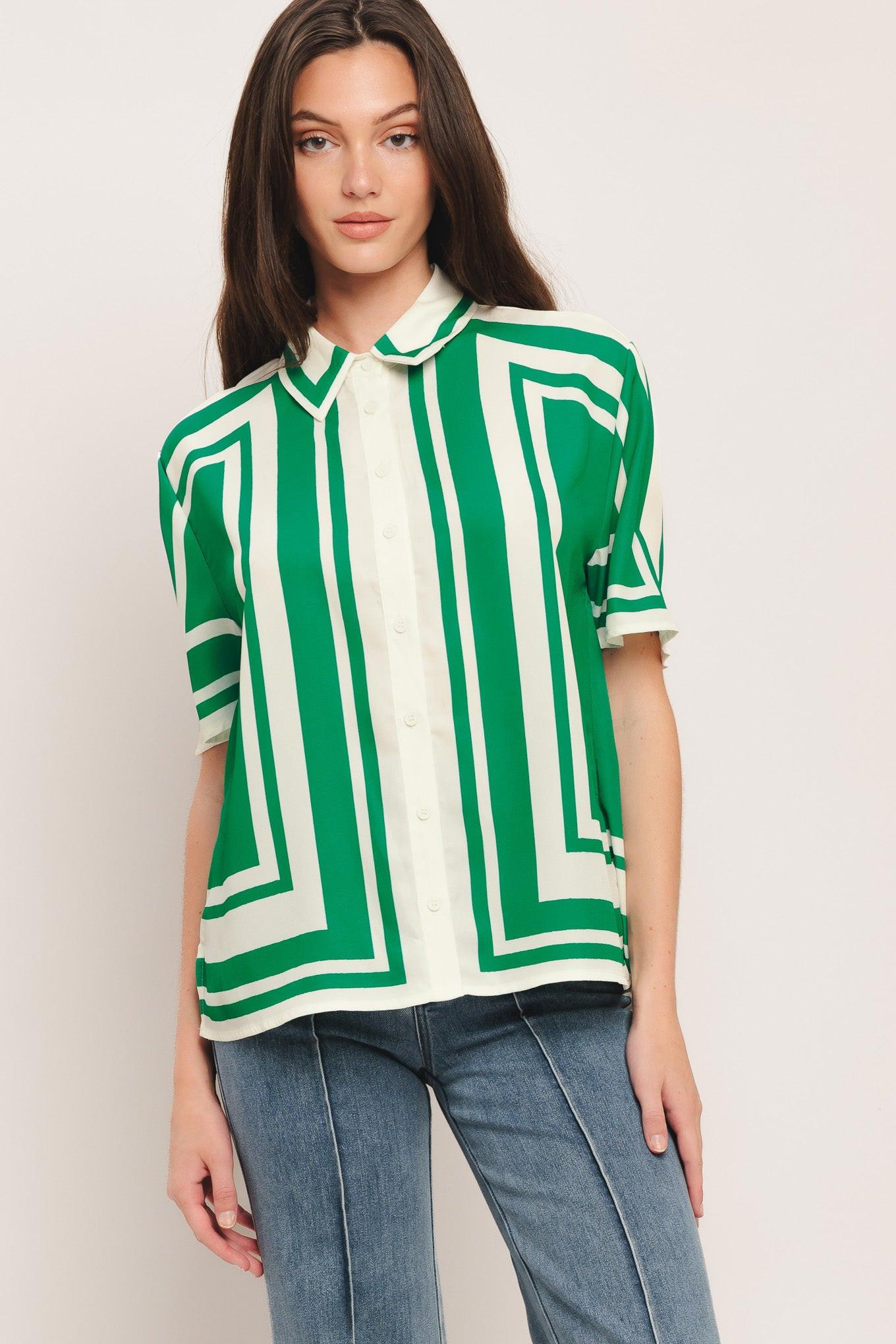 Model wearing a green and white striped woven button-down top with short sleeves and a collar
