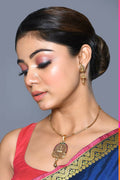 Golden Ruby Green Jadau Kundan pendant set with matching earrings