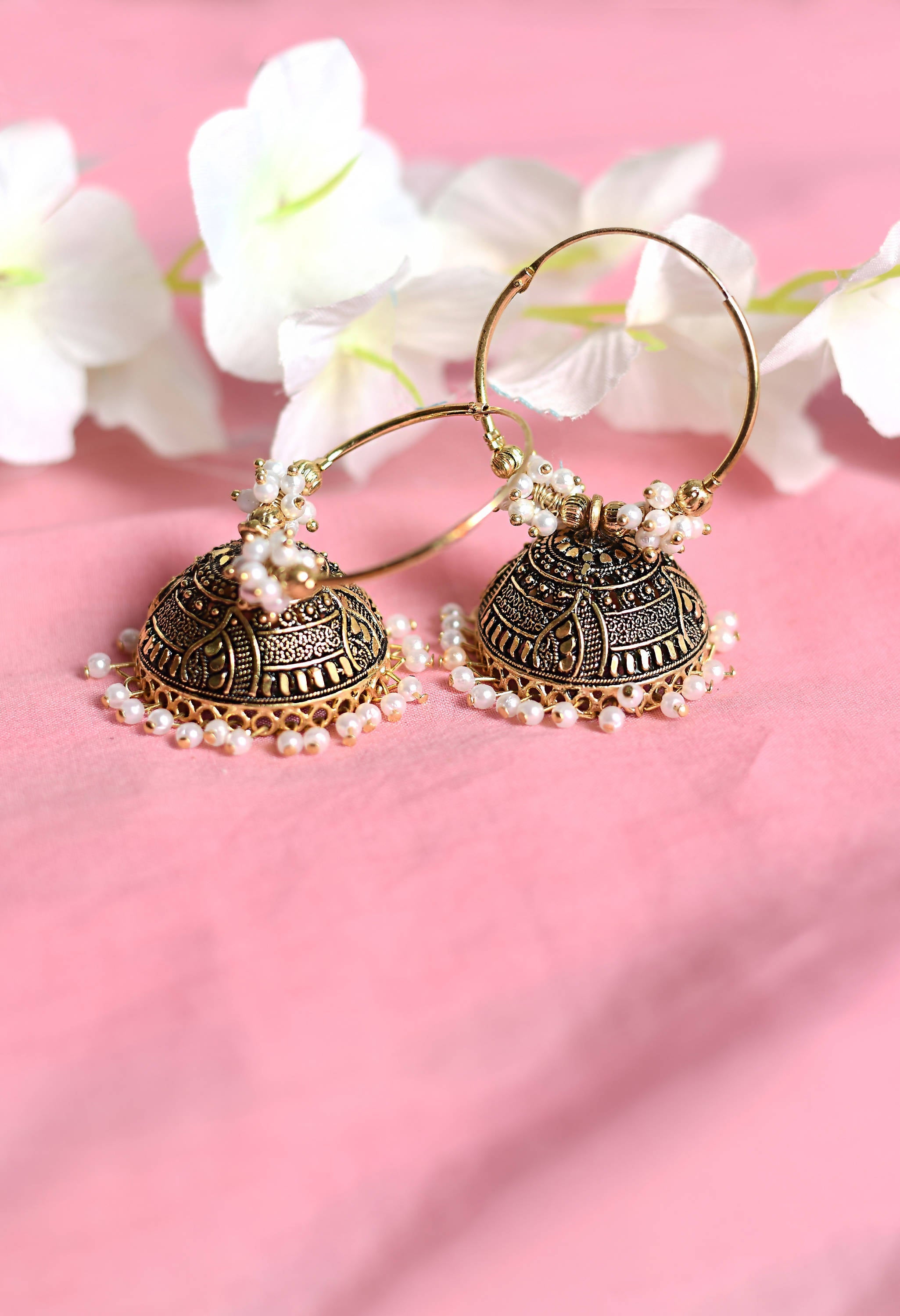 Traditional Golden Jhumka Earrings with Black and White Accents
