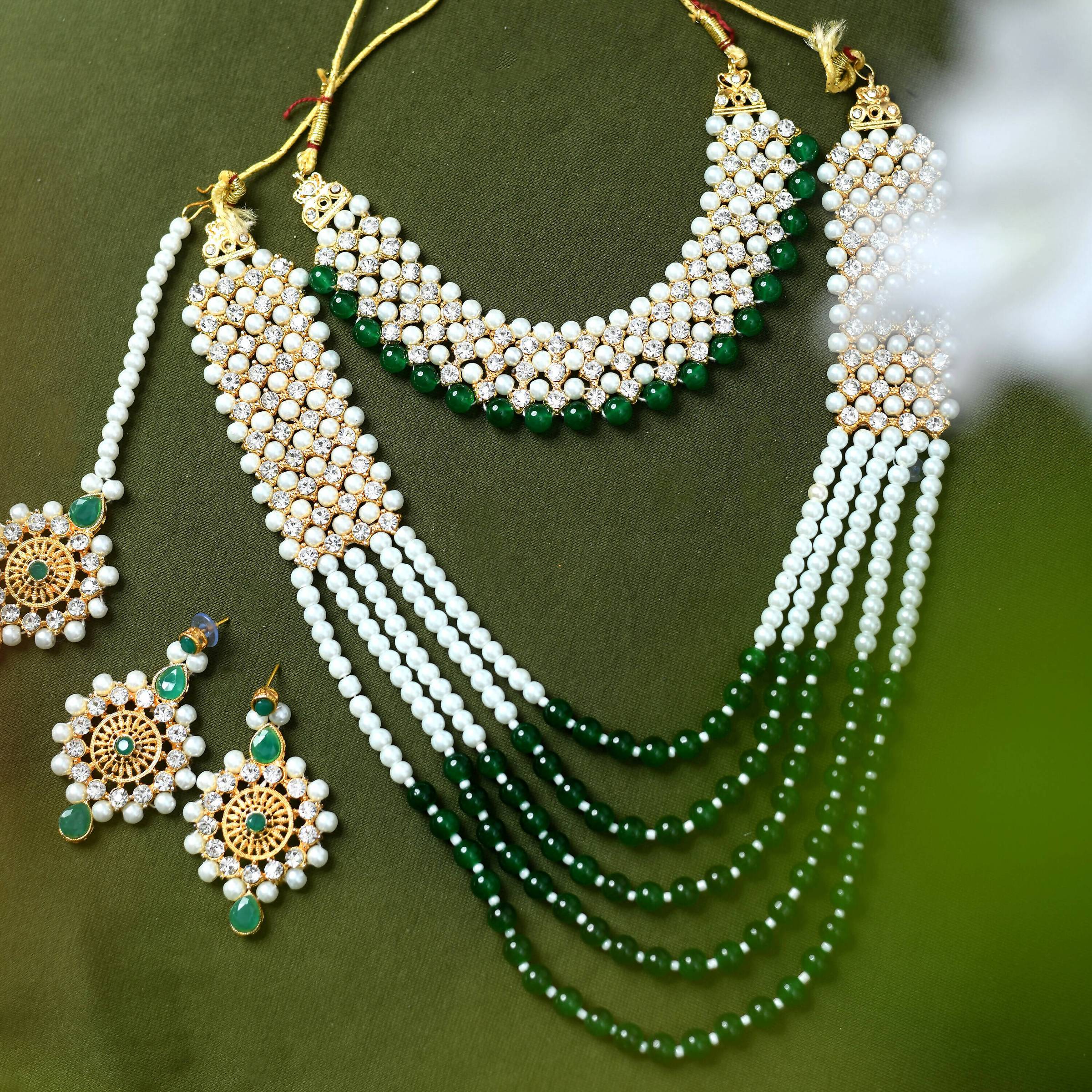 Mominos Fashion gold-plated Rani Haar long necklace featuring cream, green, and off-white pearls