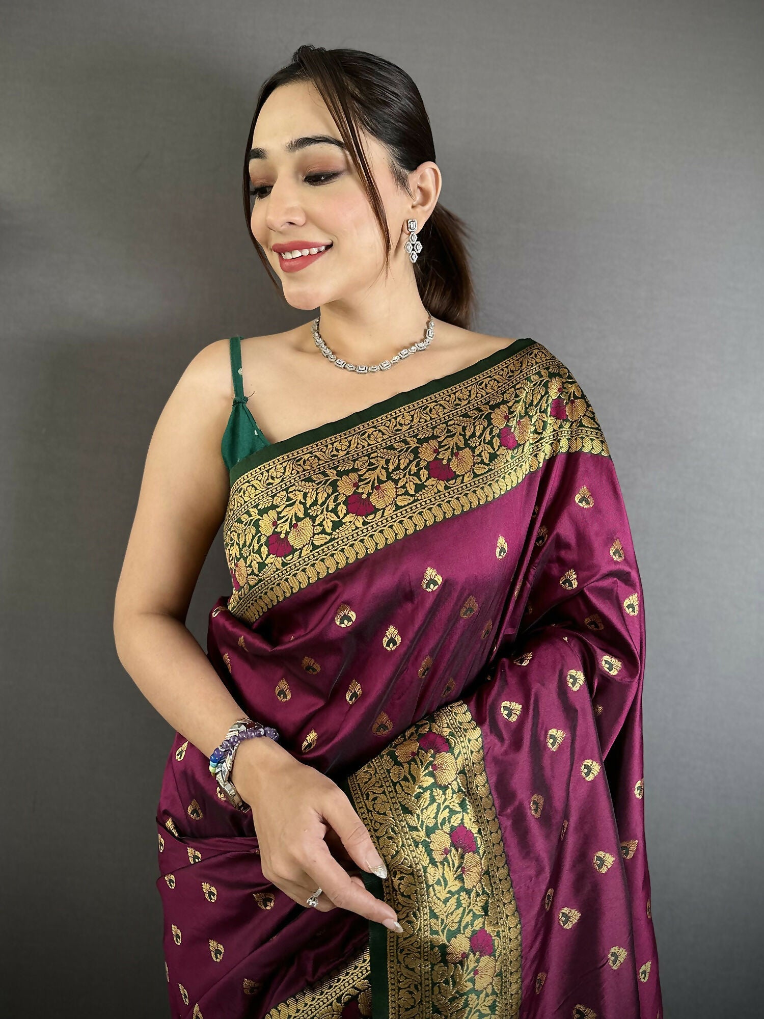 Wine Soft Silk Banarasi Saree with Intricate Motifs and Green Blouse