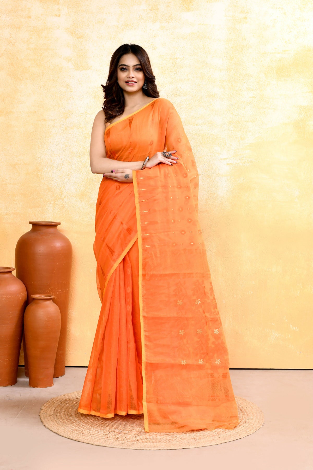 Orange cotton blend Jamdani saree with intricate embellishments for women