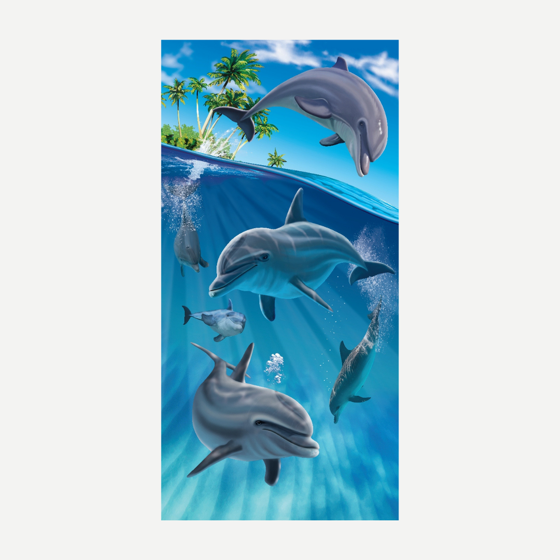 A rectangular beach towel with a vibrant print of dolphins swimming in a blue ocean with a tropical island coastline in the background.