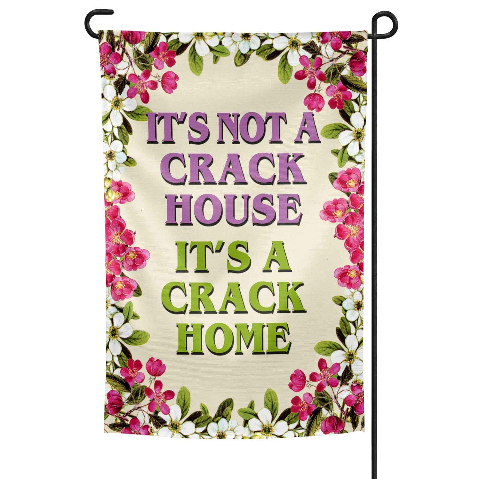 It's A Crack Home garden flag measuring 12 by 18 inches displayed on a metal stand in a green garden setting.