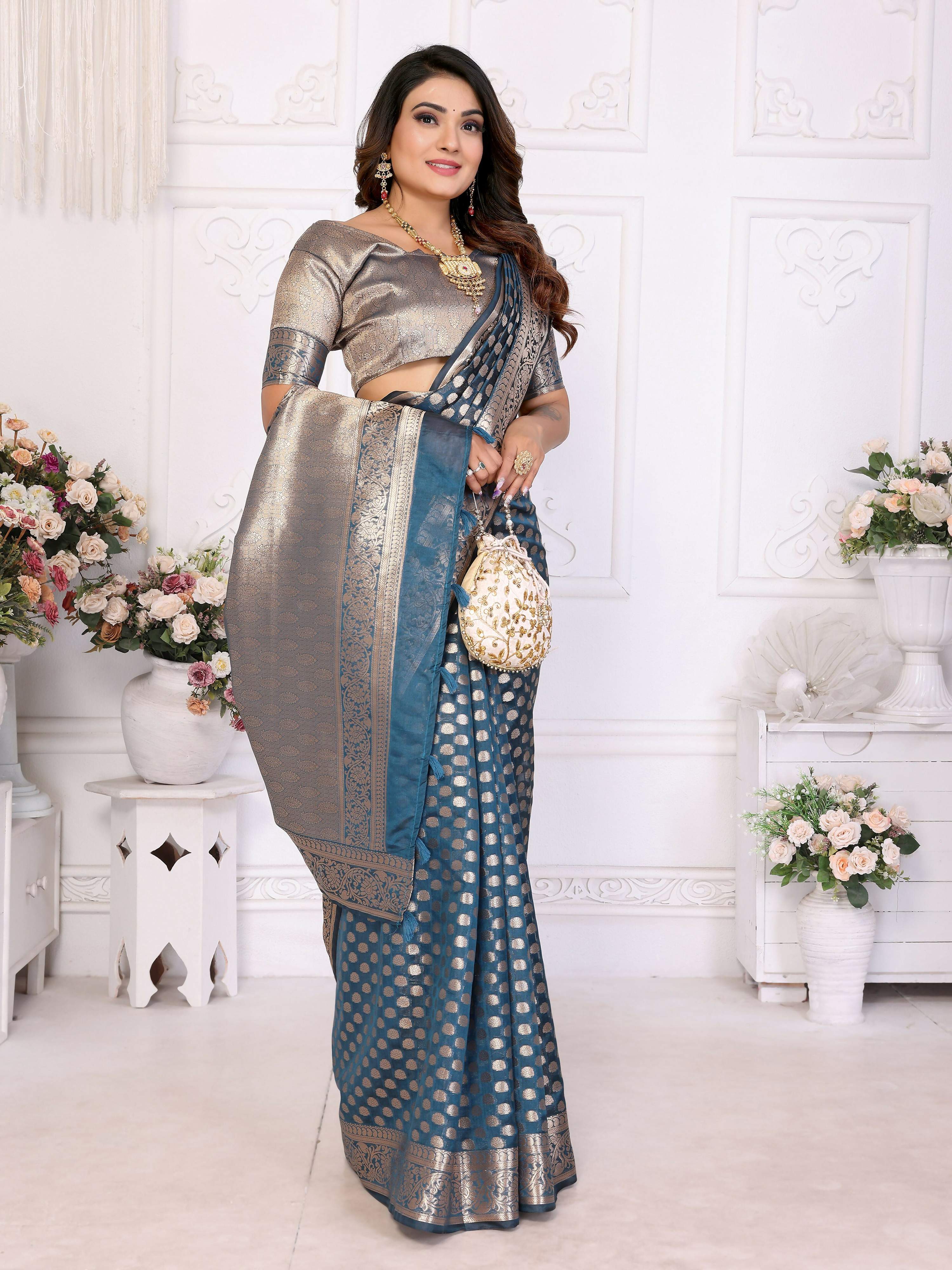 Teal Organza Silk Saree with Intricate Weaving Work
