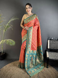 Elegant coral pink soft silk Banarasi saree with intricate motifs and matching blouse piece.
