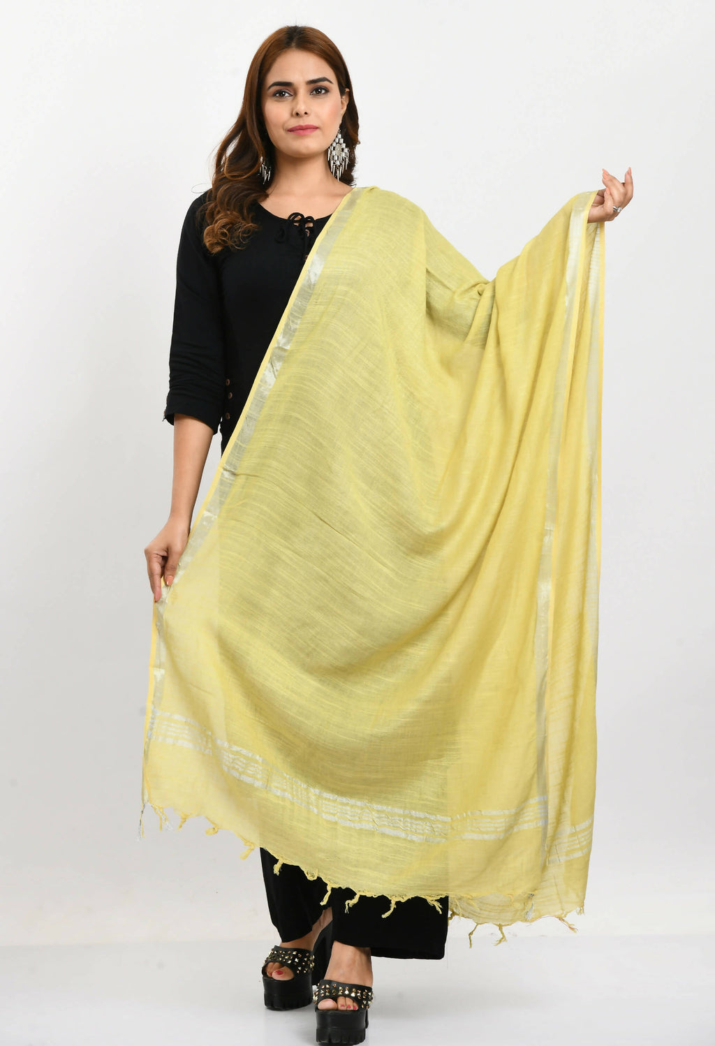 Lemon yellow linen cotton dupatta featuring a decorative silver border, folded gracefully.