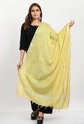 Lemon yellow linen cotton dupatta featuring a decorative silver border, folded gracefully.