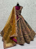 Burgundy and gold velvet wedding lehenga with embroidery and sequins