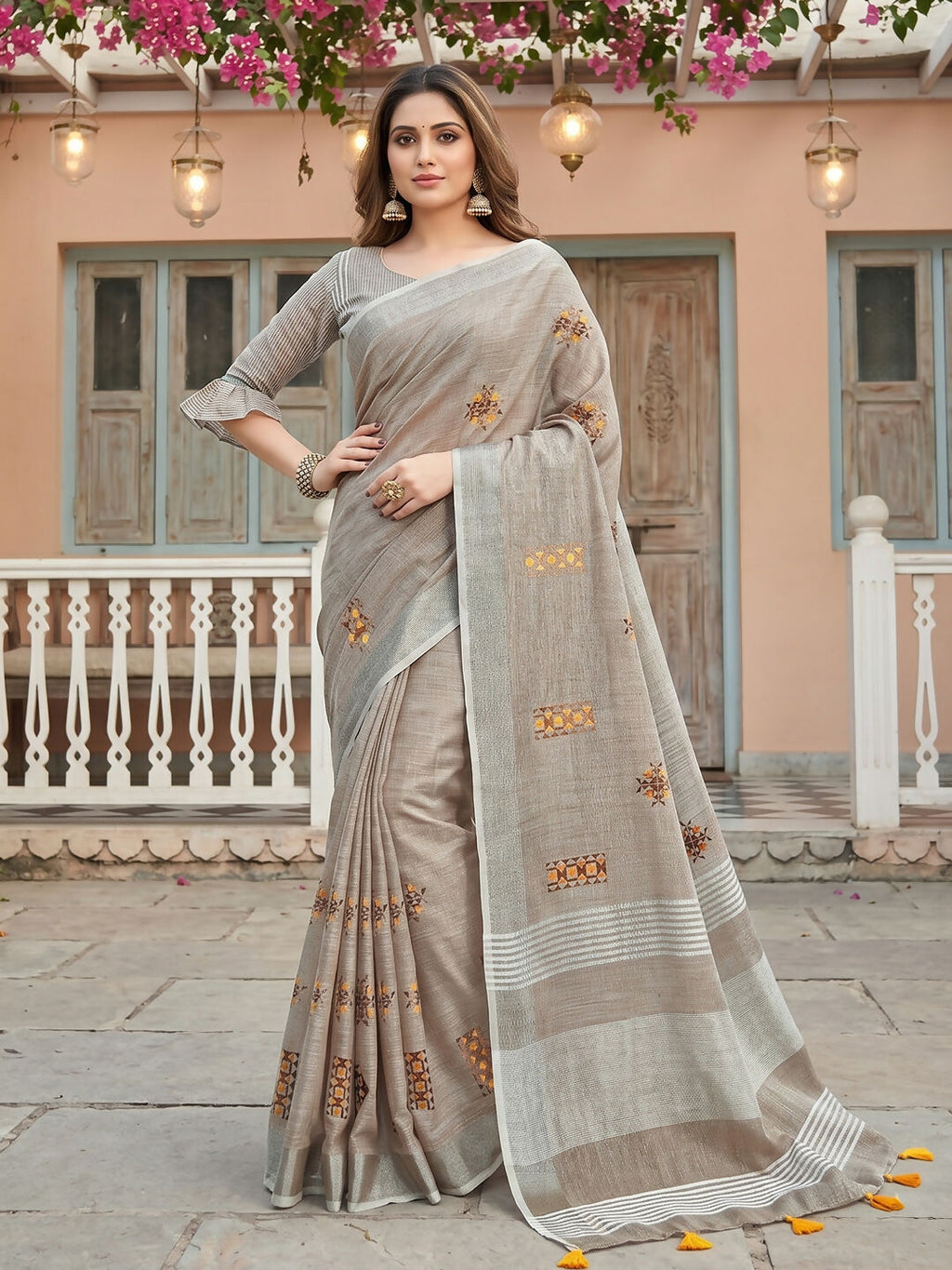 Light beige linen saree paired with matching linen blouse piece