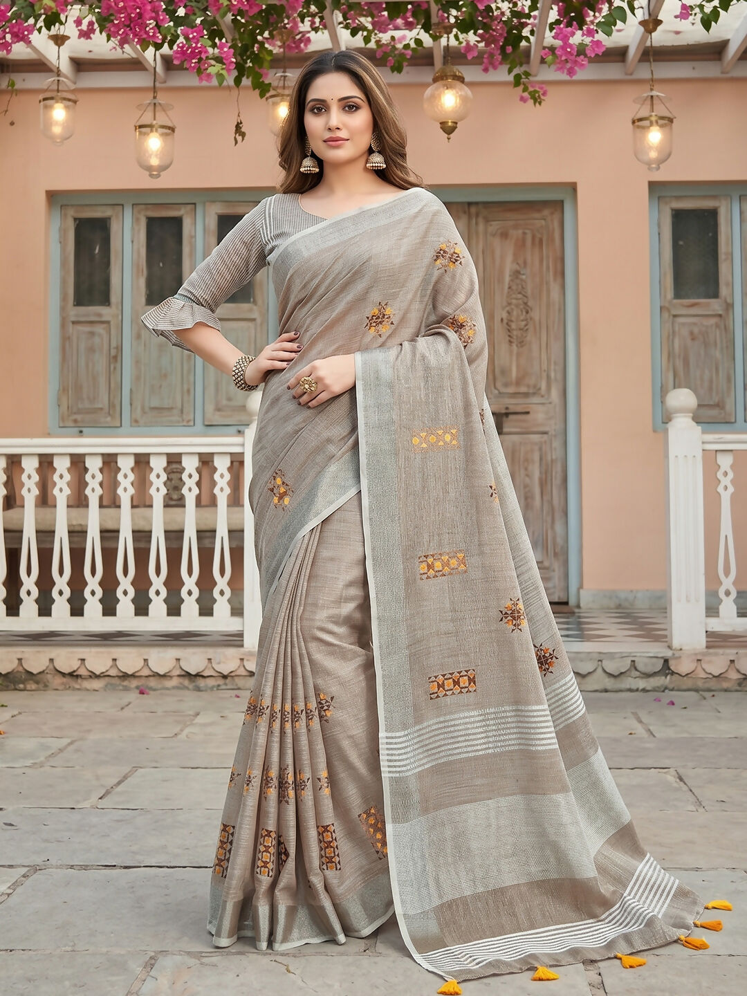 Light beige linen saree paired with matching linen blouse piece