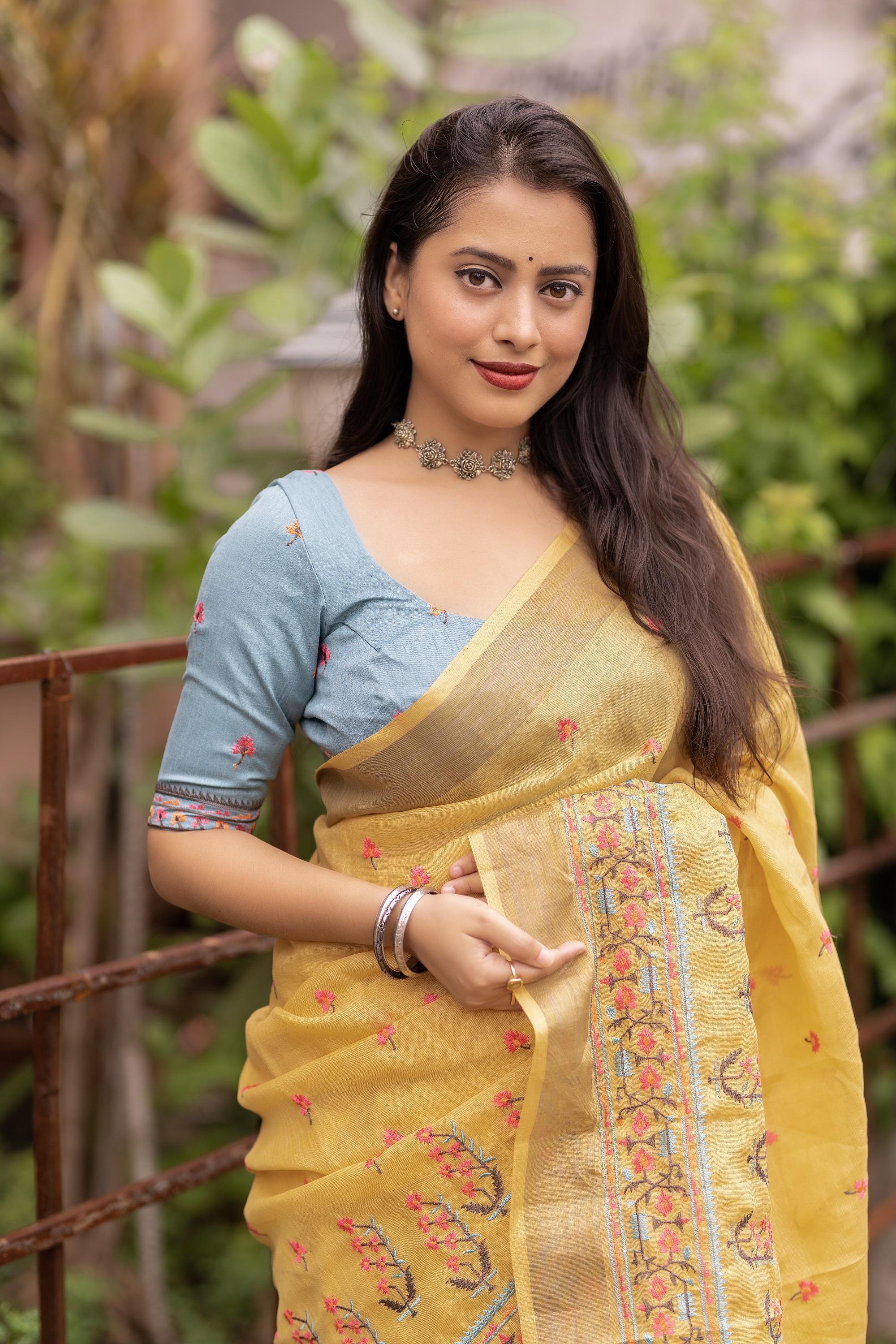 Yellow Pure Linen Saree with Ethnic Motifs and Embroidered Blouse