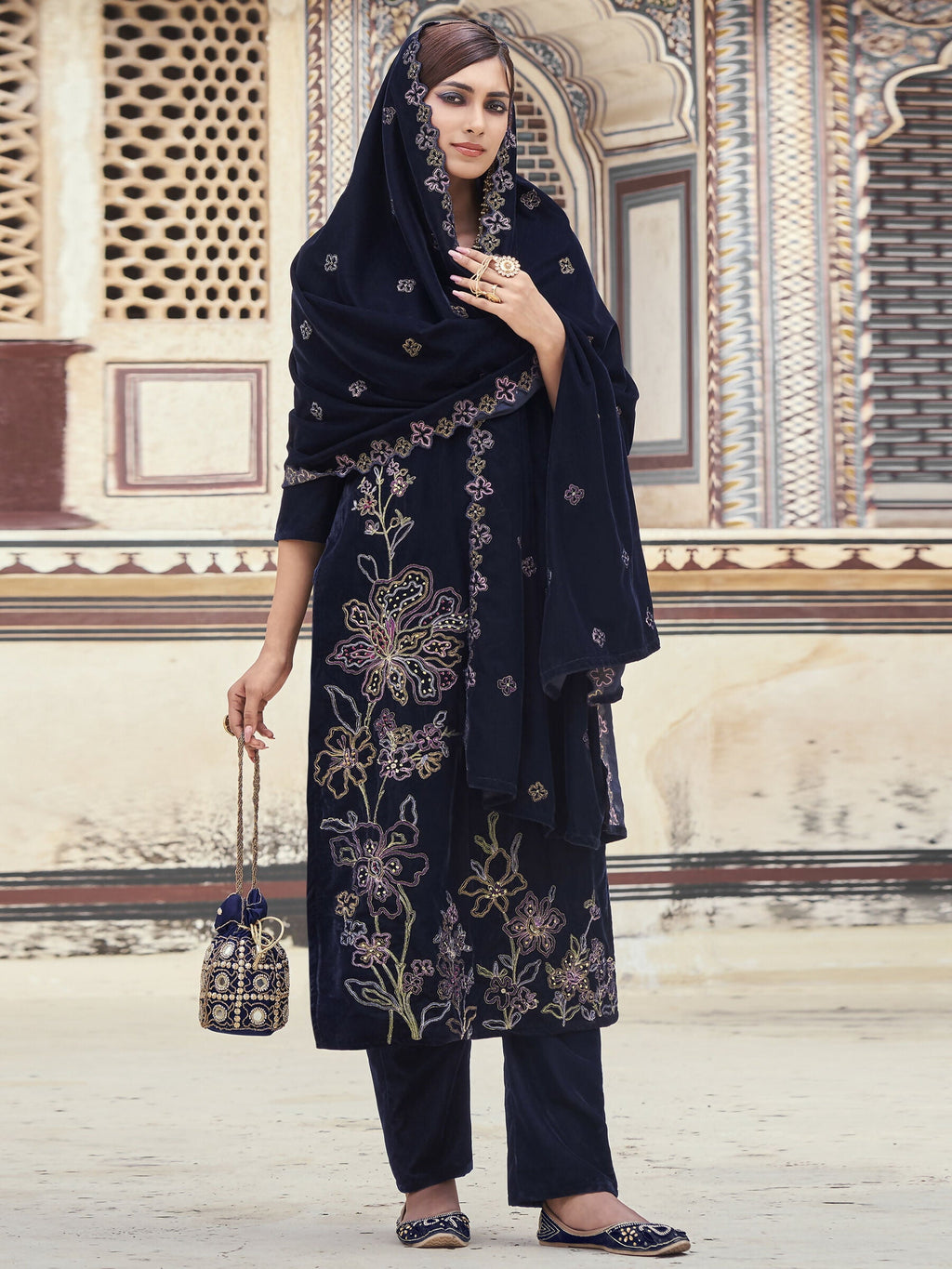 Navy blue velvet straight kurta set with Resham thread and sequin embroidery including pants and dupatta.