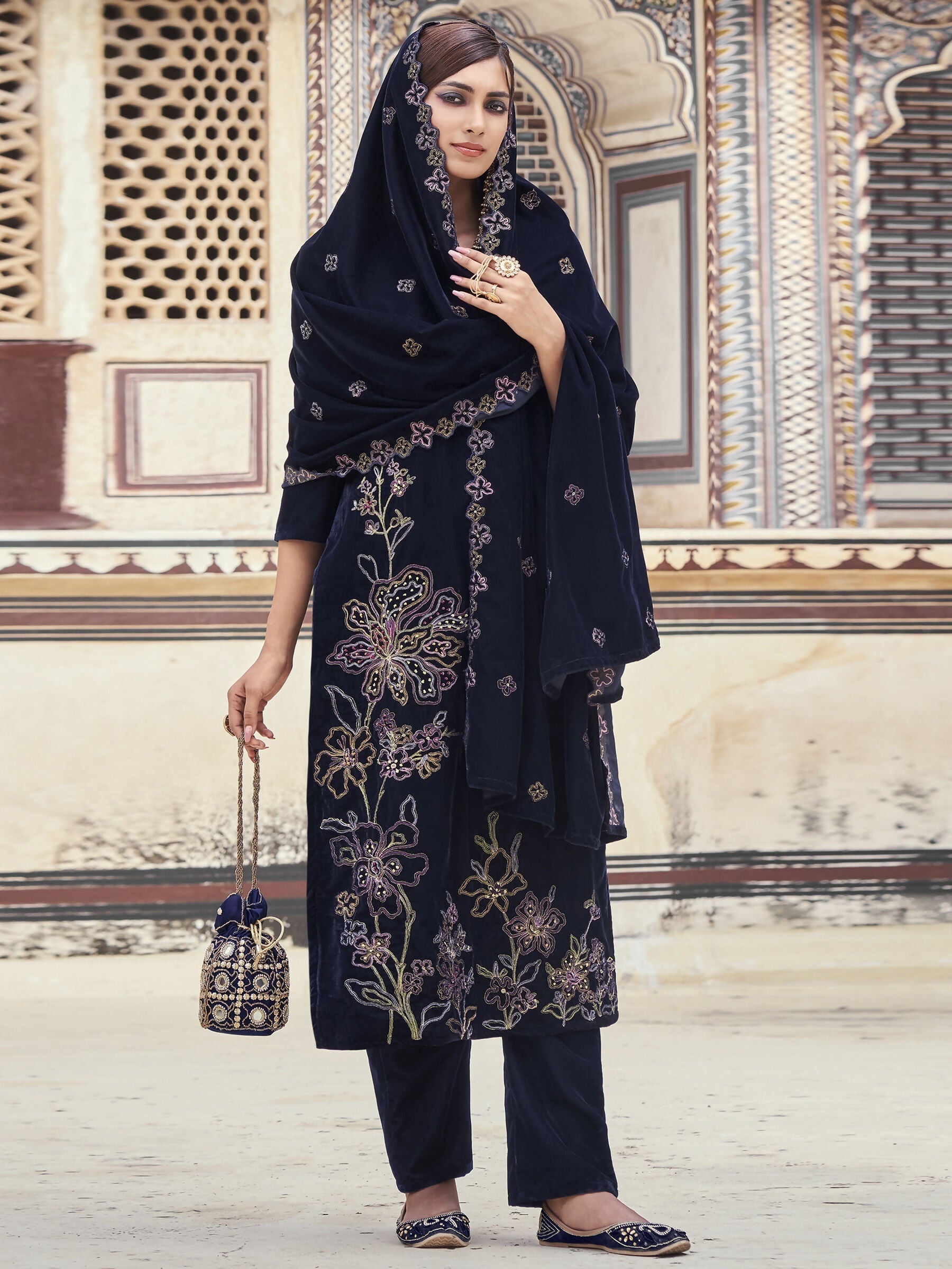Navy blue velvet straight kurta set with Resham thread and sequin embroidery including pants and dupatta.