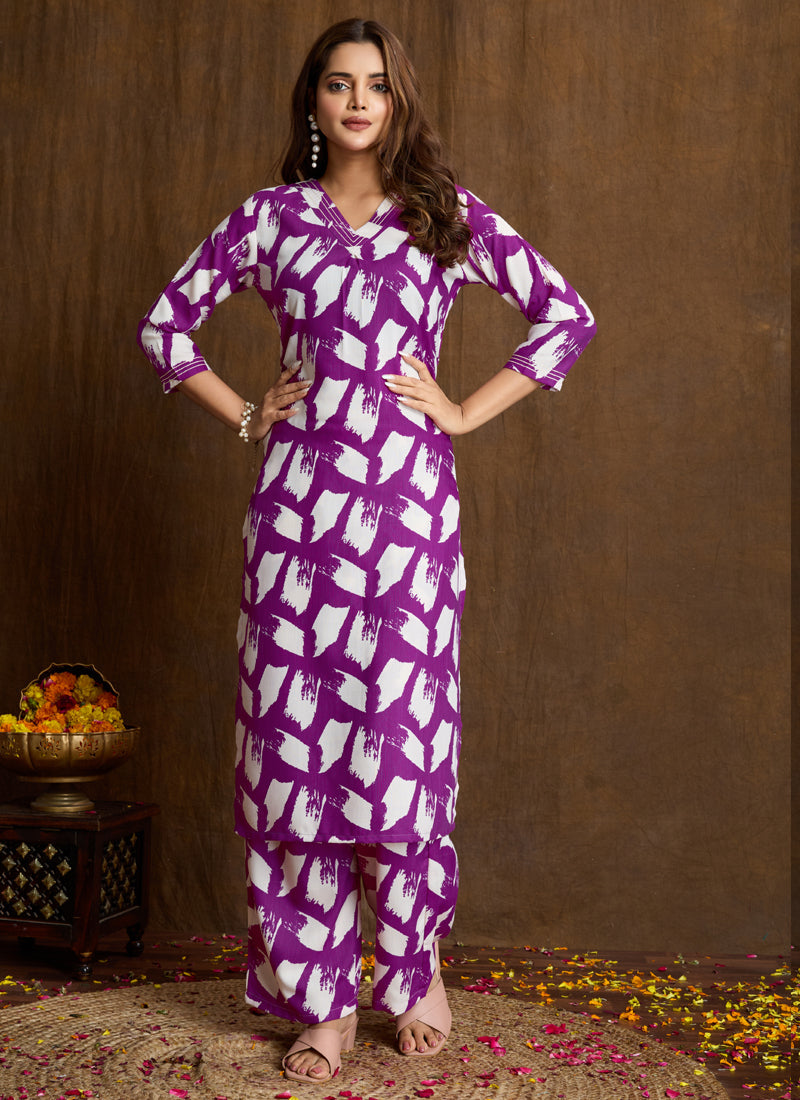 Woman wearing a purple printed cotton blend kurta with matching pants