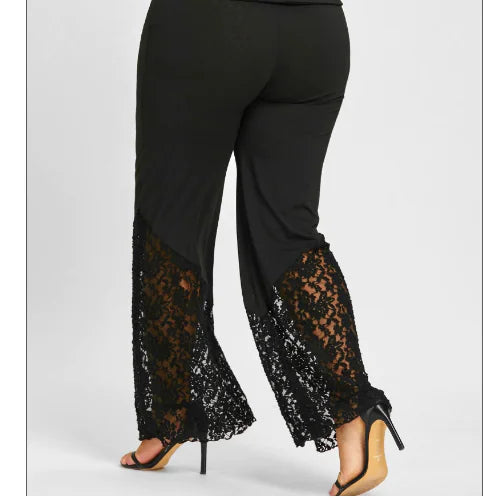Black wide leg pants with lace hem detail on a model