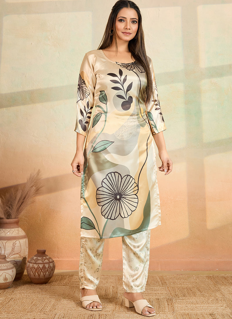 Woman wearing a stylish beige printed cotton rayon kurta and matching pant set