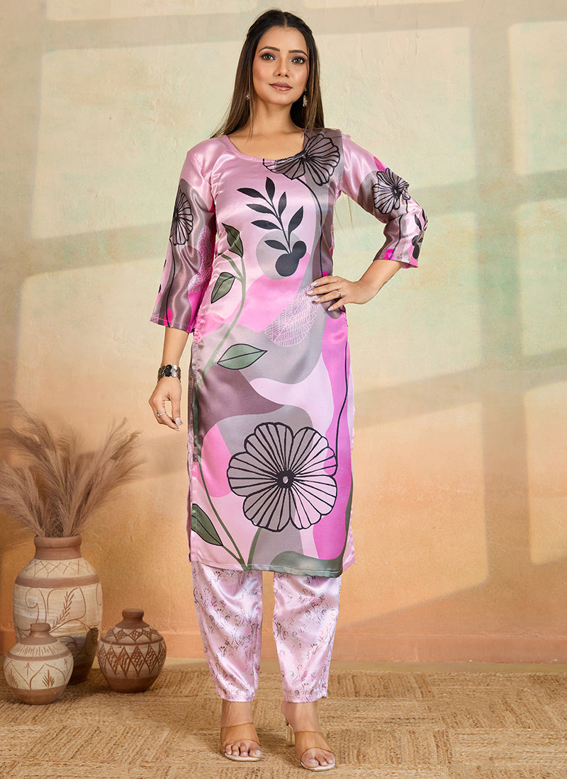 Baby wearing a baby pink printed cotton rayon kurta and matching pant set for festive occasions