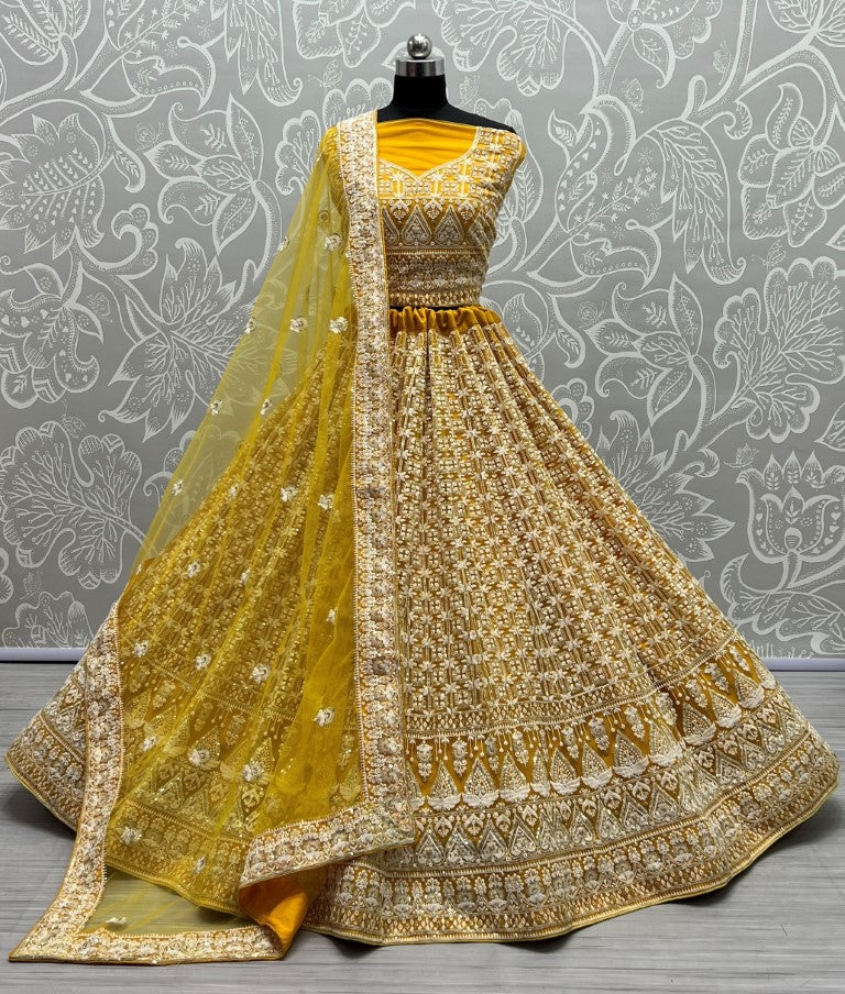 Yellow bridal net lehenga choli with fancy sequins and multi-thread embroidery
