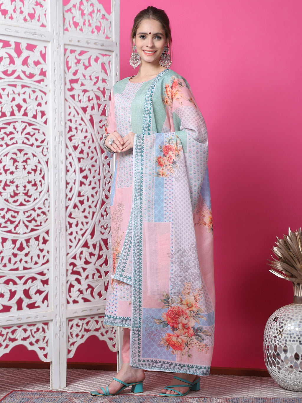 Woman wearing a multicolor cotton geometric digital print kurta with jari and crystal accents and matching dupatta.