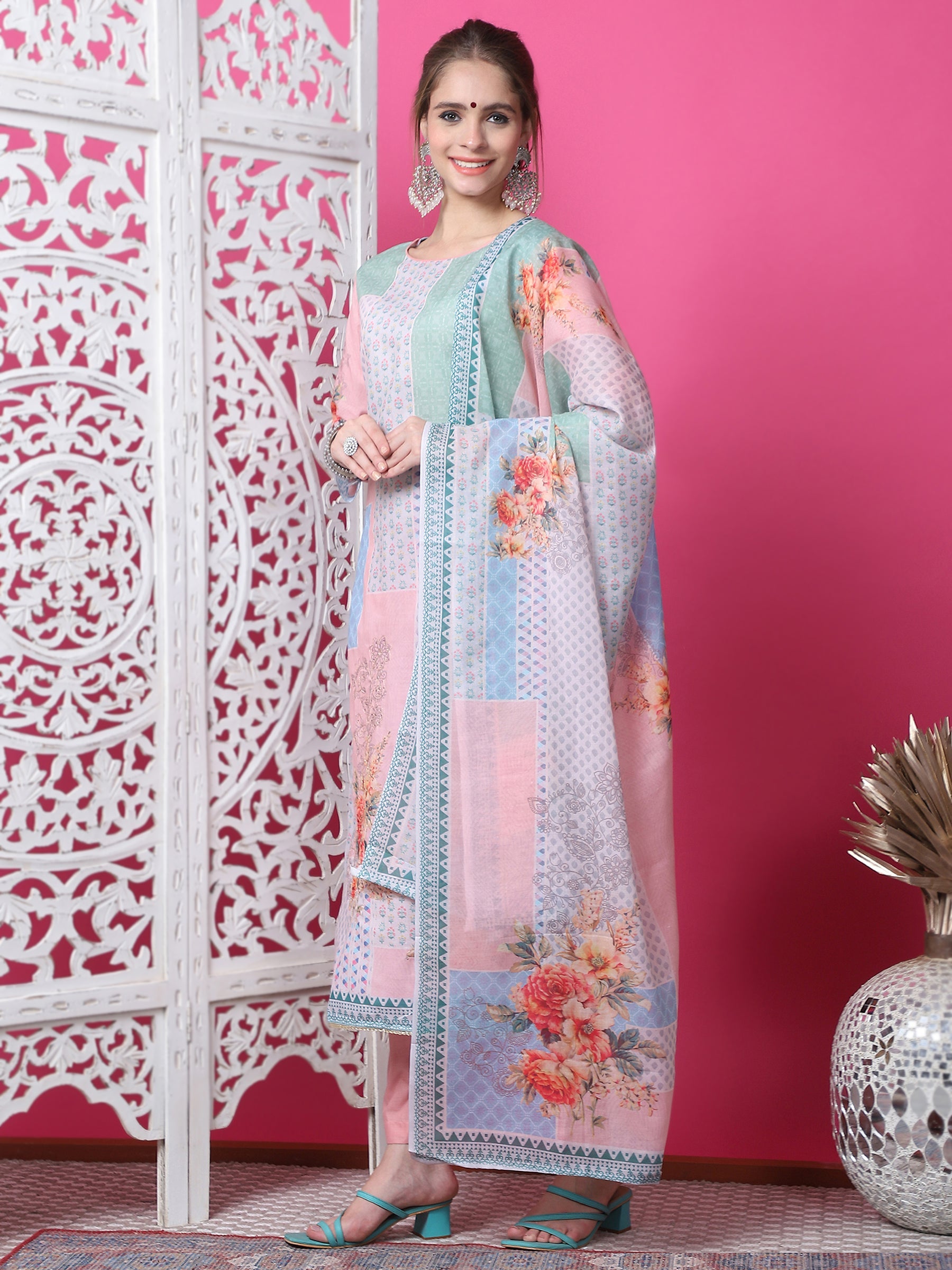 Woman wearing a multicolor cotton geometric digital print kurta with jari and crystal accents and matching dupatta.