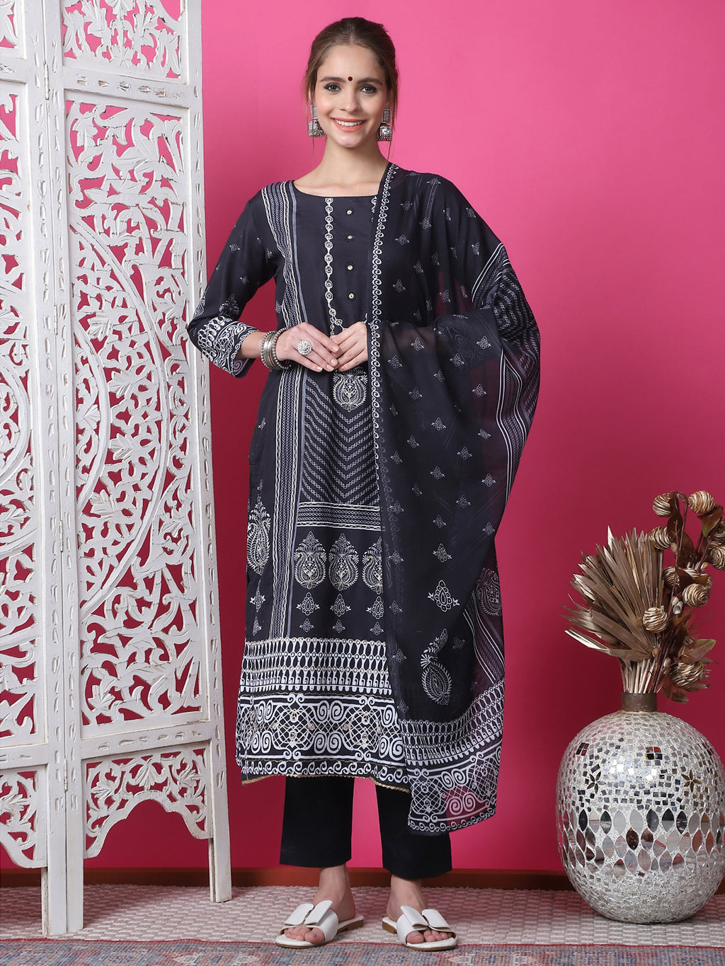 Black cotton straight kurta with geometric print, jari work, and crystal embellishments paired with trousers and dupatta.