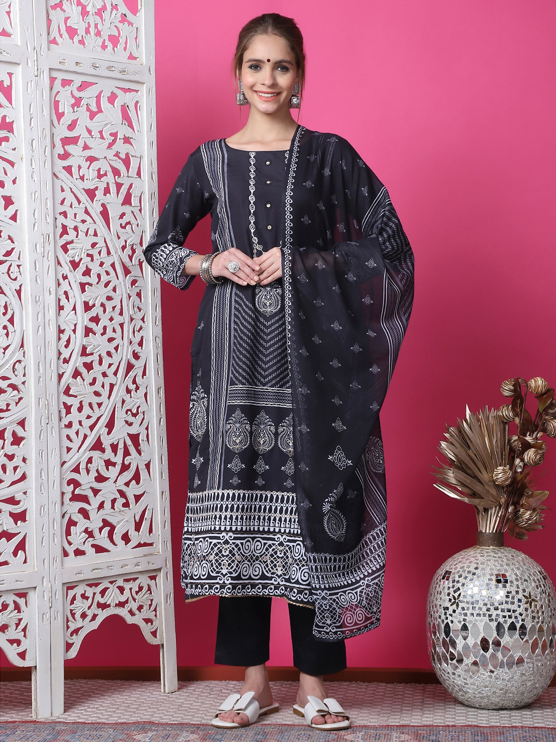 Black cotton straight kurta with geometric print, jari work, and crystal embellishments paired with trousers and dupatta.
