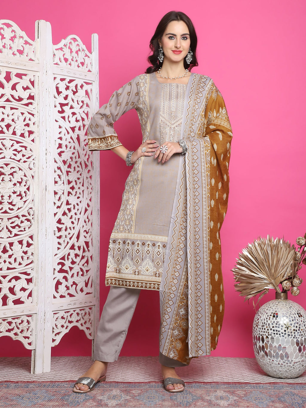 Grey cotton straight kurta with digital floral print and Resham thread work, paired with trousers and dupatta.