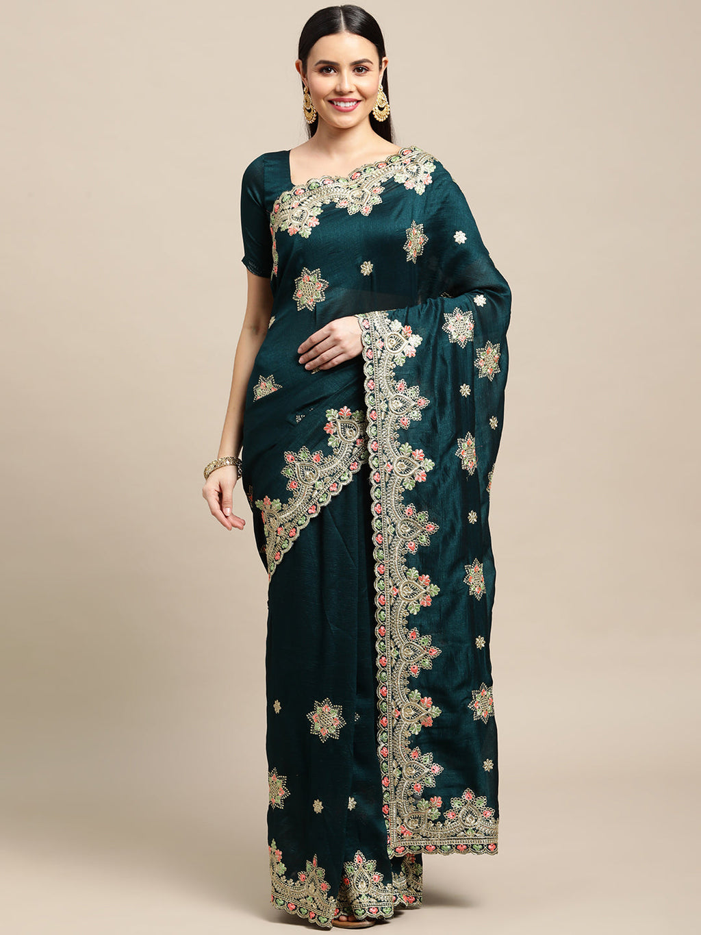 Green silk blend saree with elegant embroidery and matching blouse.