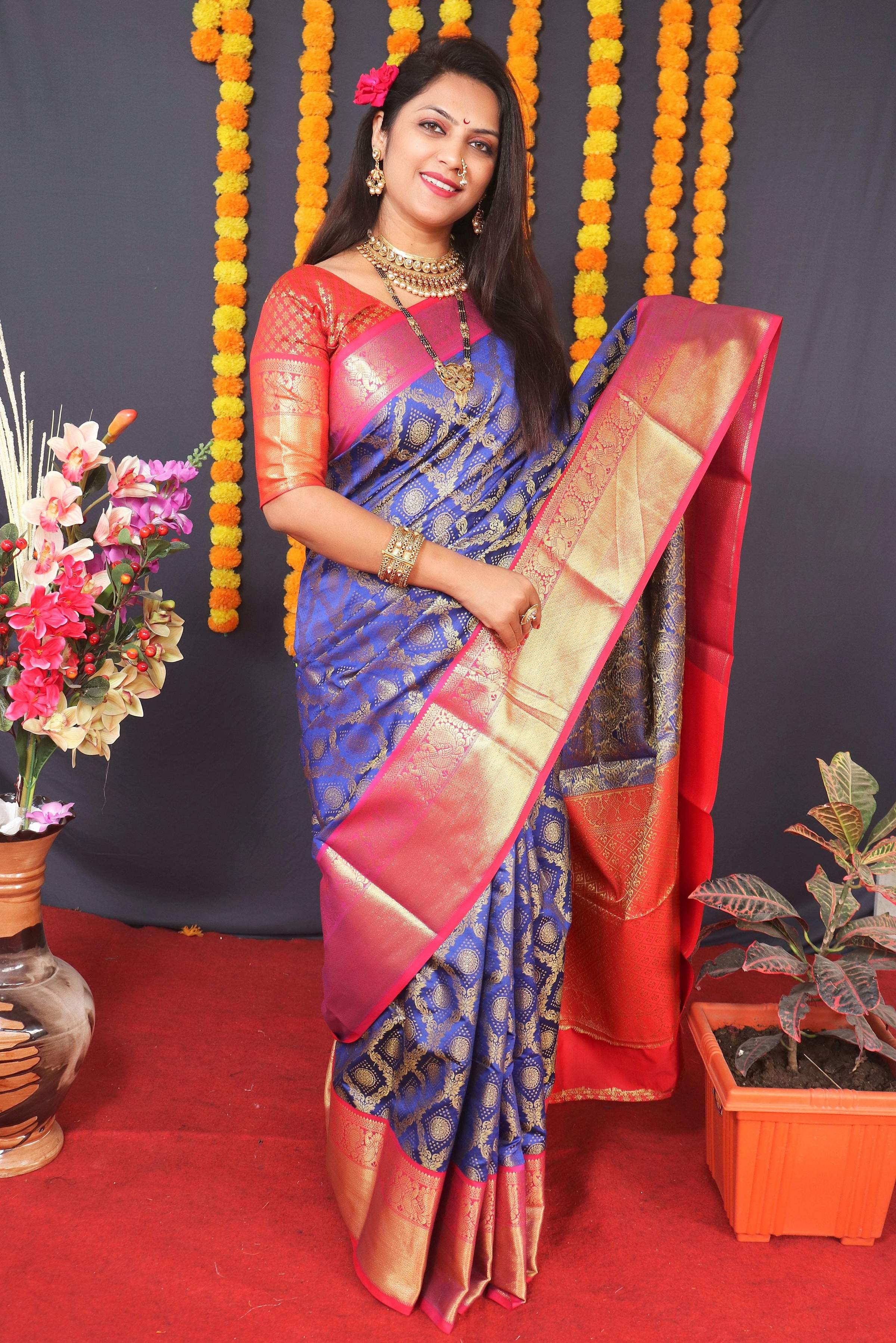 Beautiful blue Kanchipuram silk saree with intricate zari woven border and matching blouse.