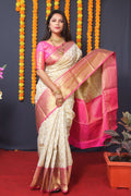 Off White Kanchipuram Silk saree with Zari woven borders and a pink blouse piece