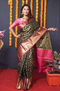 Black Kanchipuram silk saree with intricate zari woven borders.
