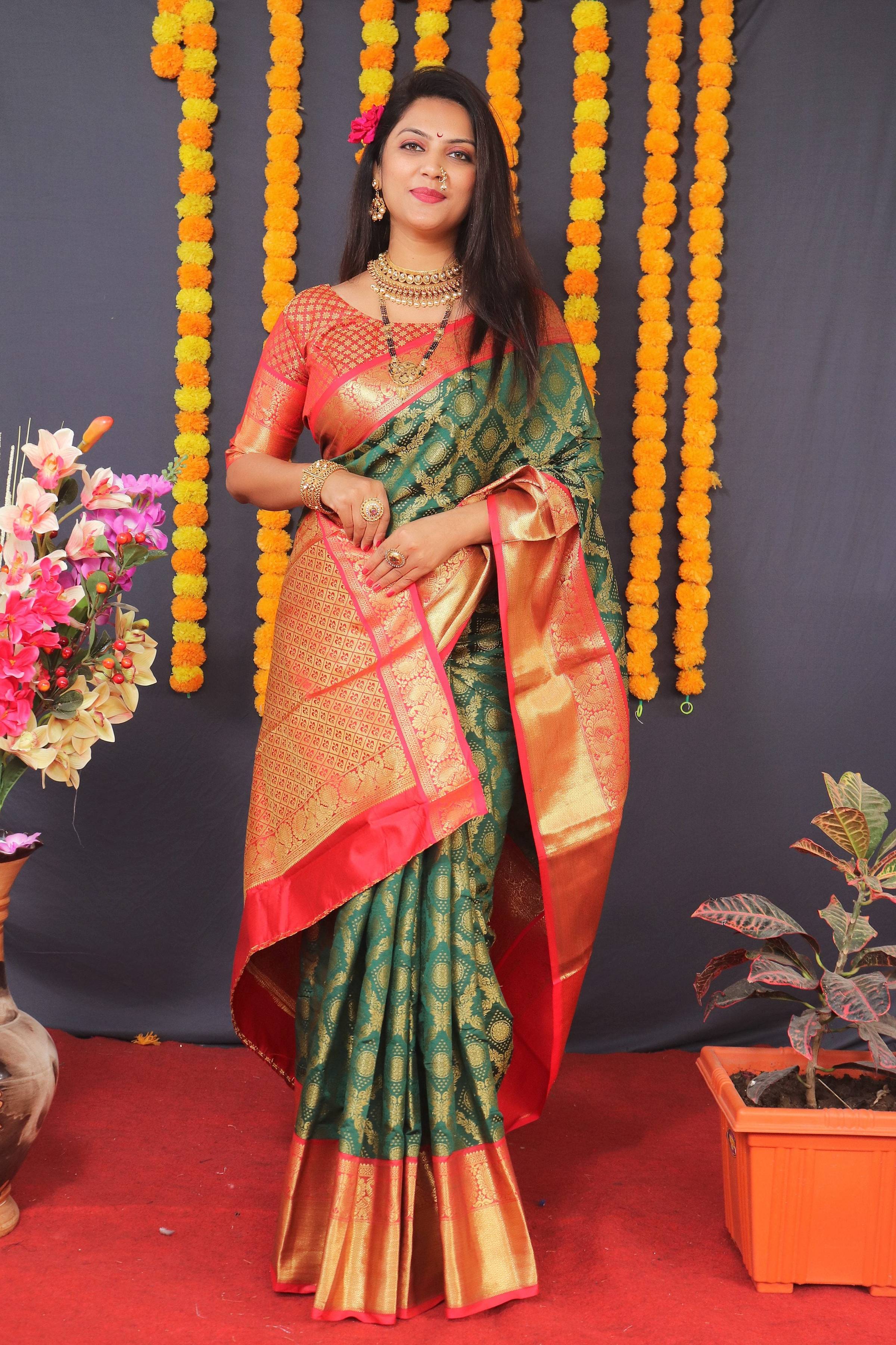 Green Kanchipuram silk saree with elegant Zari work and matching blouse