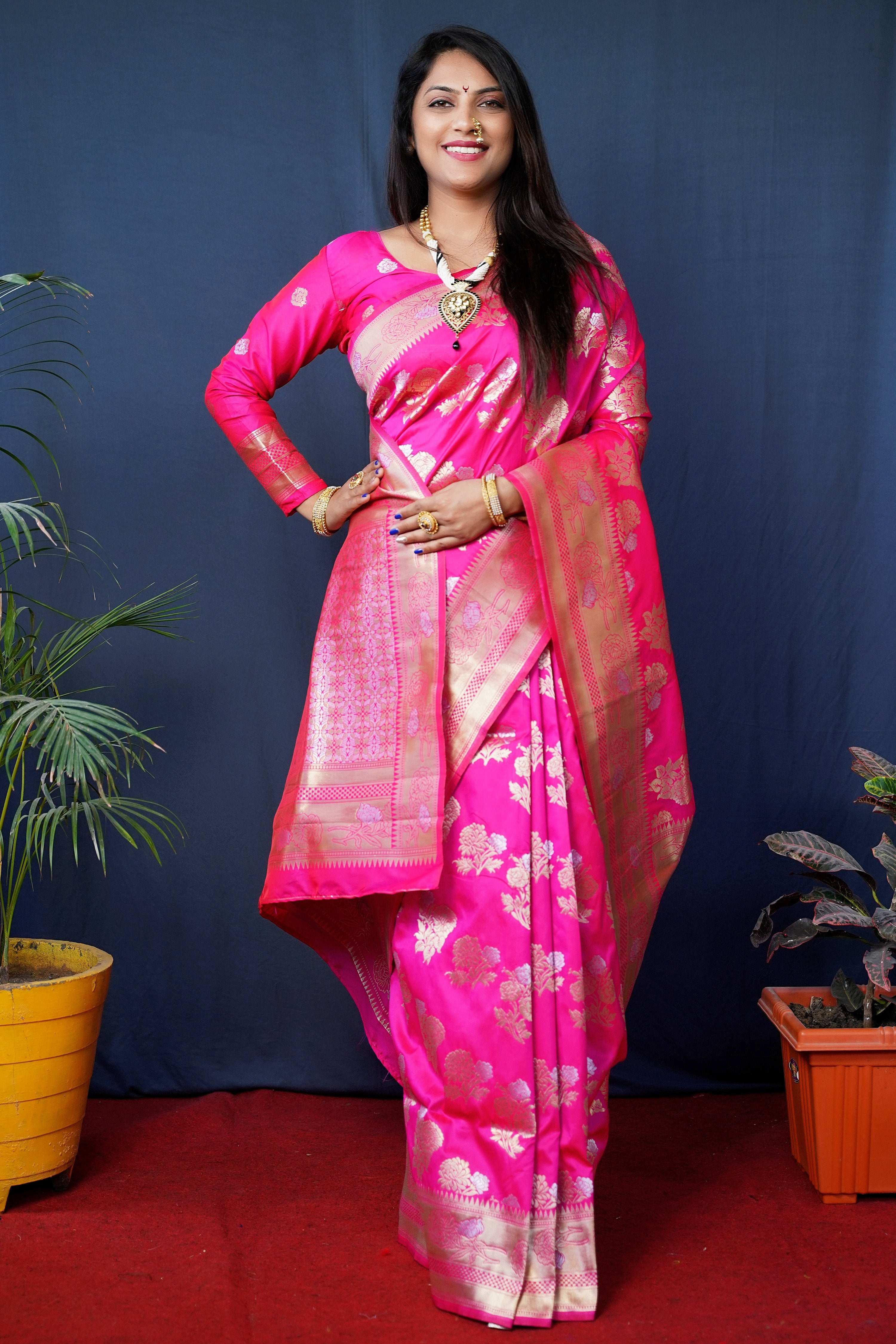 Pink handloom Banarasi silk saree with zari woven borders and blouse.