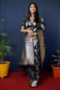 Black handloom Banarasi silk saree with intricate Zari woven detailing and matching blouse.