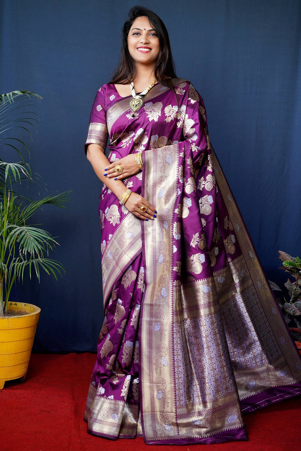 Wine handloom Banarasi silk saree with gold zari woven details and matching blouse