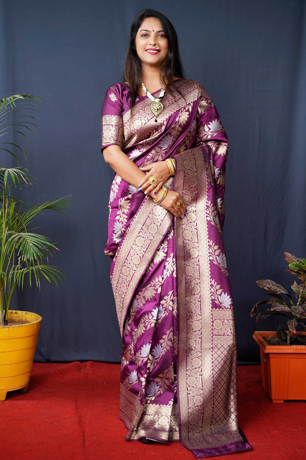 Wine colored handloom Banarasi silk saree with gold zari woven work and blouse