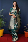Green handloom Banarasi silk saree with detailed zari woven patterns.