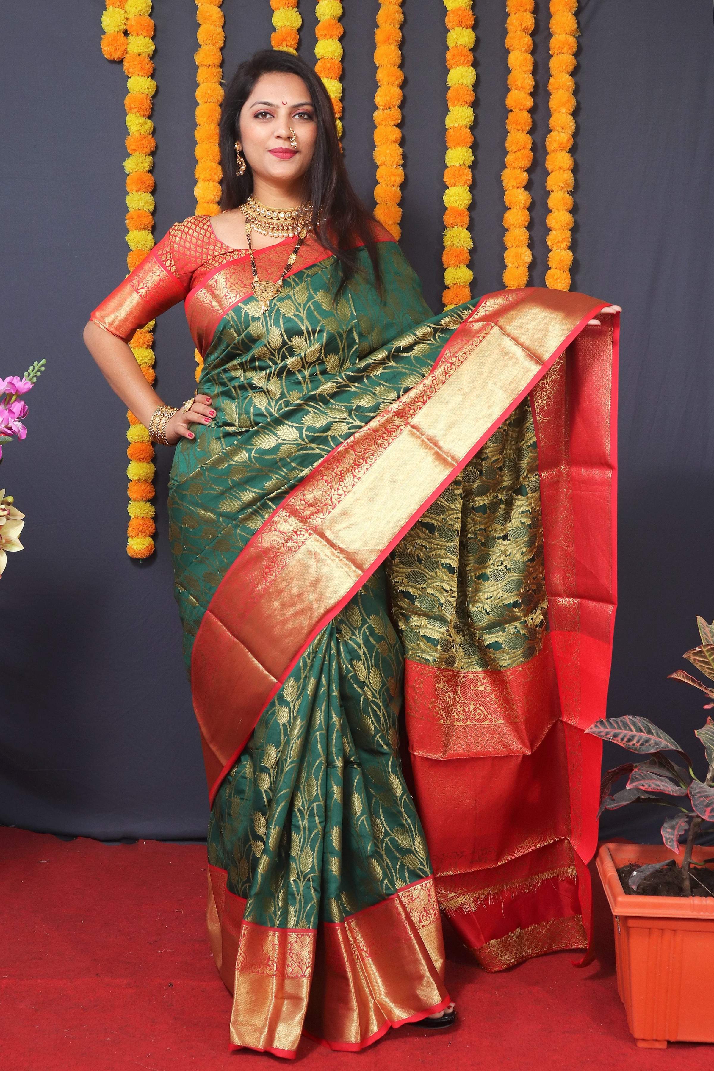 Green Kanchipuram Silk saree with decorative Zari woven motifs and matching blouse