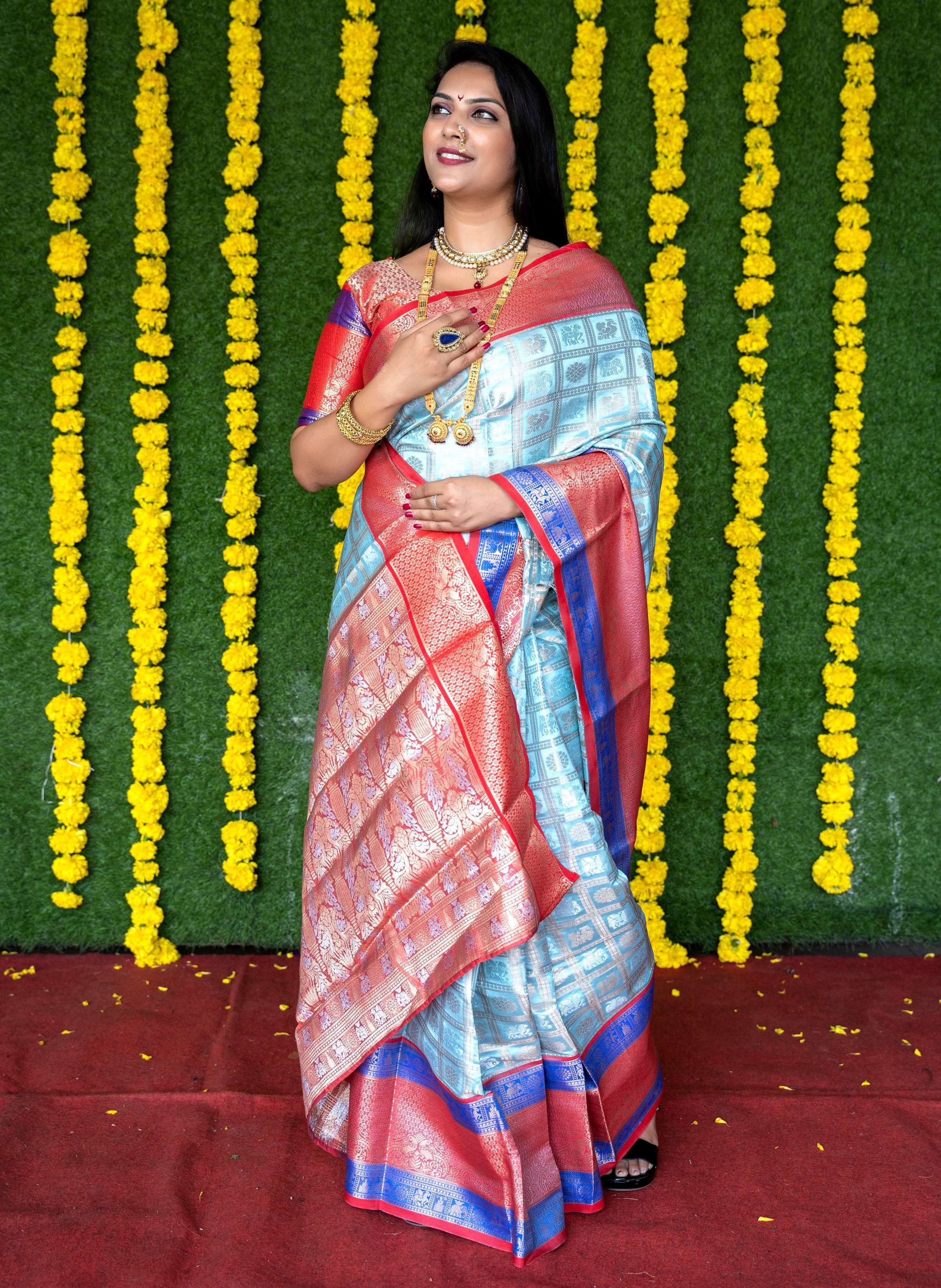 Sky Blue Kanchipuram Silk saree with elegant Zari woven patterns and matching blouse