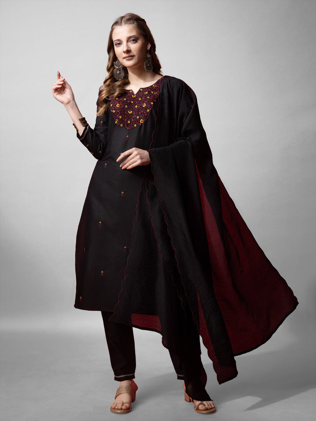 Front view of a black cotton blend straight kurta featuring embroidery details and 3/4 sleeves