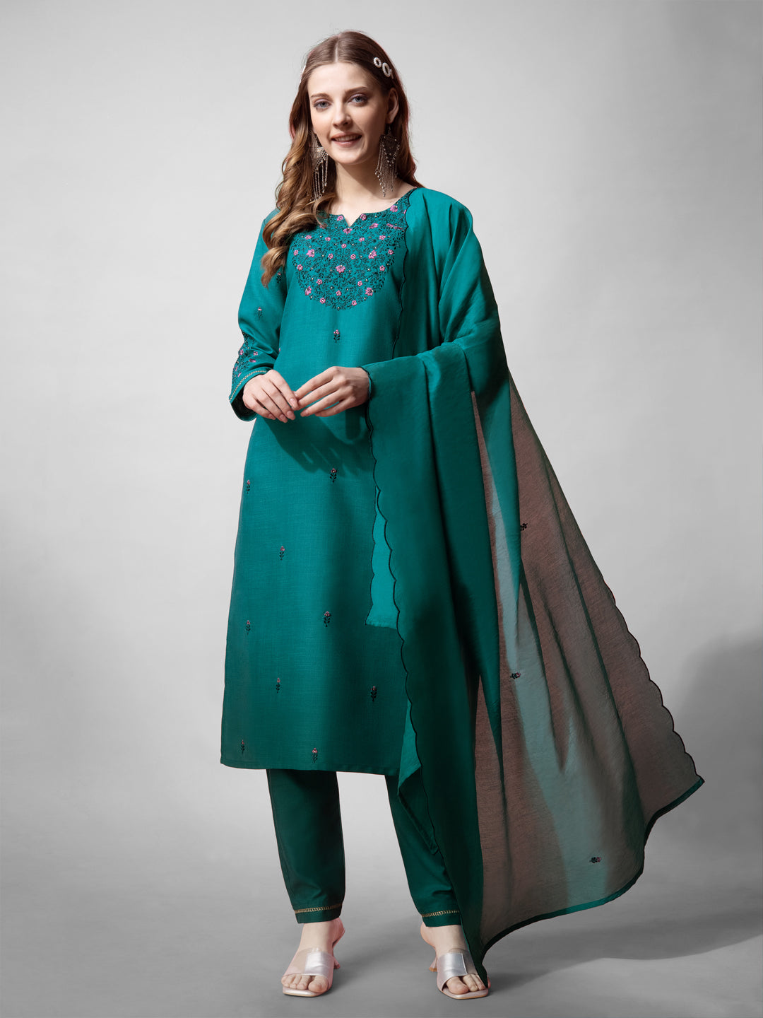 A woman wearing a Rama green cotton blend kurta set with floral embroidery and 3/4 sleeves.